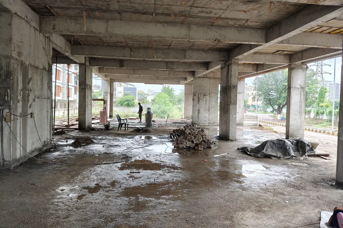 Inside the cast basement parking level at Vasantara Skies — columns and beams complete